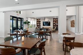 Glendale apartment for rent - a dining room with tables and chairs and a television