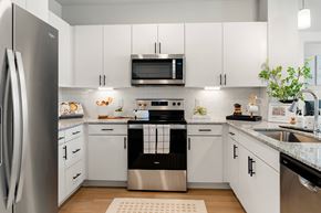 Glendale apartment for rent - a white kitchen with stainless steel appliances and white cabinets