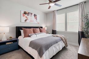 Mesa apartment for rent - a bedroom with a bed and a ceiling fan