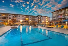 San Antonio apartment for rent - a resort-style pool and patio area at a senior apartment community