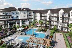 Naples apartment for rent - an aerial view of a resort-style pool and courtyard at a senior apartment community