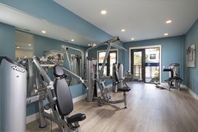 Houston apartment for rent - a gym with fitness machines at a senior apartment community