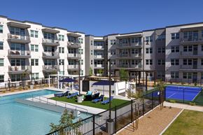 Las Vegas apartment for rent - a resort-style pool and lounge area, and pickleball court at a senior apartment community