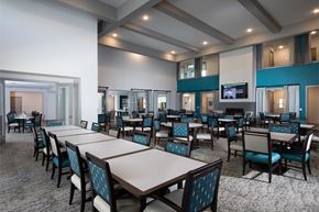 Rowlett apartment for rent - a resident dining area at a senior apartment community