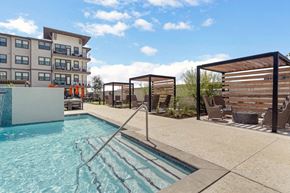 Kyle apartment for rent - A swimming pool with a slide in the middle of it.