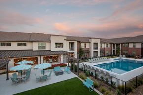 Rowlett apartment for rent - resort-style pool and courtyard at a senior apartment community