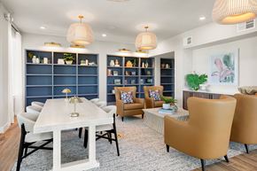 Naples apartment for rent - A modern dining room with a white table and chairs.