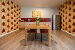 Naples apartment for rent - A dining room with a wooden table and chairs.