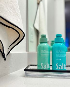 Kissimmee apartment for rent - Two bottles of salt water are on a shelf at The Teale Siesta Lago in Kissimmee, FL, 34746