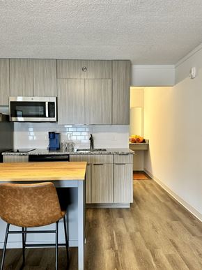 North Charleston apartment for rent - a kitchen with a island and a stove and a microwave at The Teale Navy Yard, North Charleston, 29405