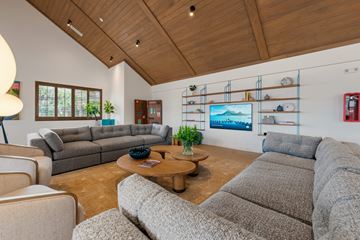 Melbourne apartment for rent - A living room with a grey couch and a wooden coffee table.
