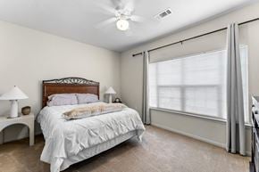 Alexandria apartment for rent - a bedroom with a large window and a bed
