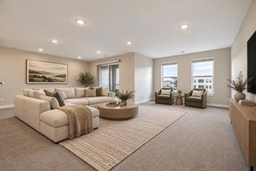 Mason apartment for rent - A living room with a large sectional sofa and a coffee table.