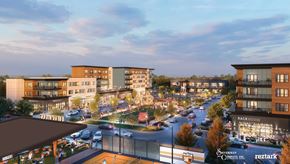 Mason apartment for rent - A city street with cars and buildings with a sign at The District at Deerfield Residences Apartments, Mason, OH, 45040
