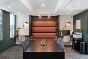 Mason apartment for rent - A conference room with a long table and chairs.