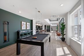 Mason apartment for rent - A room with a pool table and a green wall.