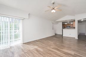 Brighton apartment for rent - A room with a ceiling fan and wooden flooring.