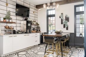 Grand Rapids apartment for rent - A kitchen with a patterned floor and a dining table with chairs.
