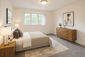 East Lansing apartment for rent - A bedroom with a bed, nightstand, and a painting on the wall.