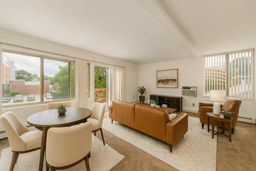 East Lansing apartment for rent - A living room with a brown couch and a coffee table.