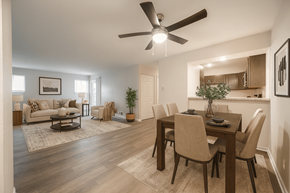 Comstock Park apartment for rent - A modern dining room with a wooden table and chairs.