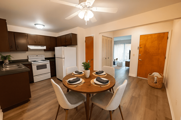Lansing apartment for rent - A kitchen with a dining table set for two.