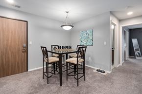 East Lansing apartment for rent - A dining room with a table and chairs.