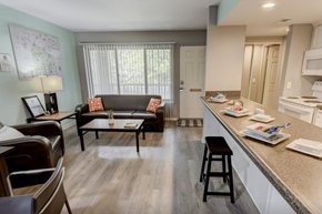 Okemos apartment for rent - A kitchen with a table and chairs in the middle of the room.