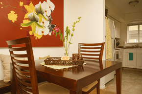 Lansing townhouse for rent - A dining room with a wooden table and chairs.