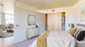 Detroit apartment for rent - a bedroom with a bed and a dresser
