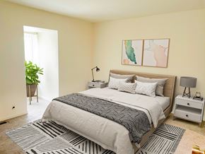 East Lansing apartment for rent - a bedroom with a bed and a rug