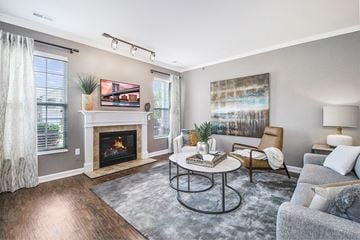 Ada apartment for rent - a living room with a fireplace and a couch