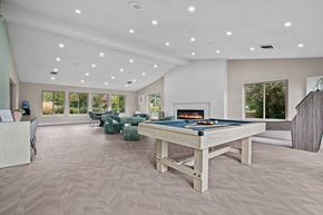 Farmington Hills apartment for rent - a game room with a pool table and a fireplace at Edge At Farmington Hills - Farmington Hills, MI, Michigan, 48334