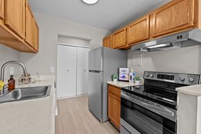 Troy apartment for rent - A kitchen with wooden cabinets and stainless steel appliances.