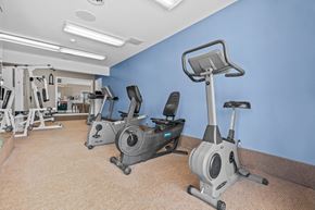 Roseville townhouse for rent - a room filled with lots of exercise equipment