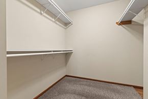 Midland townhouse for rent - the preserve at ballantyne commons spacious walk in closet with white walls and shelves