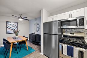 Ann Arbor townhouse for rent - A modern kitchen with a dining table and chairs.