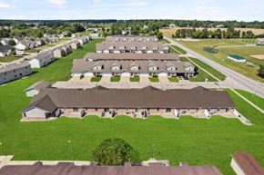 Freeland triplex for rent - an aerial view of a group of buildings in a field