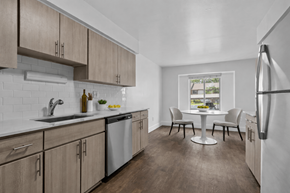 Farmington Hills apartment for rent - A kitchen with wooden cabinets and a white fridge.