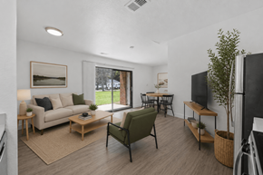 Grand Rapids apartment for rent - A living room with a couch, chair, and a television.