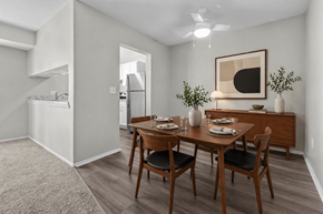 Waterford apartment for rent - A dining room with a table set for two and a painting on the wall.