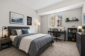 Waterford apartment for rent - A bedroom with a bed, desk, and chair.