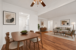West Bloomfield apartment for rent - A modern dining room with a wooden table and chairs.