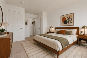 Warren apartment for rent - A bedroom with a large bed and a painting above it.