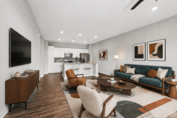 Grand Rapids apartment for rent - A modern living room with a green sofa and wooden furniture.
