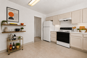Southfield apartment for rent - A kitchen with white appliances and a white fridge.