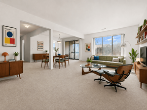 Southfield apartment for rent - A living room with a sofa, chairs, and a television.
