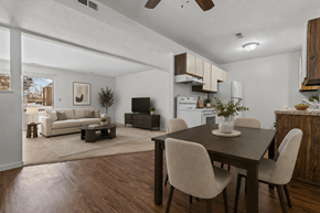 Flint apartment for rent - A modern dining room with a wooden table and chairs.