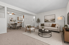 Flint apartment for rent - A living room with a couch, chairs, and a coffee table.