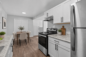 Flint apartment for rent - A modern kitchen with a dining table and chairs.